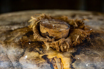 Aging process of cognac spirit in old dark French oak barrels in cellar in distillery house, Cognac white wine region, Charente, Segonzac, Grand Champagne, France