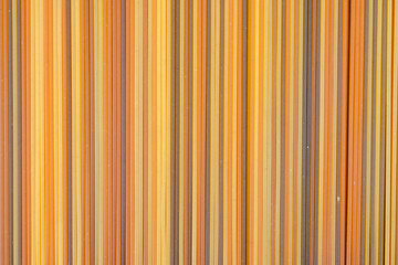 Food background, colorul dried pasta spaghetti, paralleled lines, wallpapers with stripes