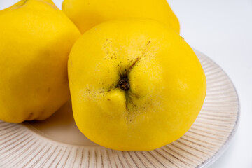 Group of ripe yellow quince apples close up