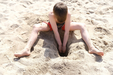 happy child on beach, healthy boy 9-10 years old fun playing on shore near water mediterranean sea,...