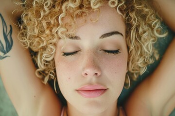 Fototapeta premium A close-up shot of a woman with her eyes closed, providing intimate and private moment