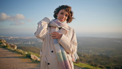 Relaxed woman contemplating coastal evening feeling serenity happiness closeup.