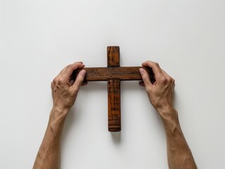 Person holding wooden cross
