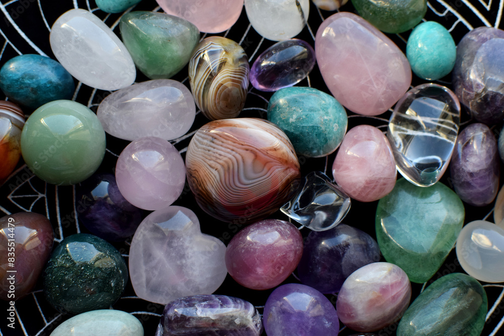 Wall mural beautiful natural semi-precious stones lie on a dark background. predictions, witchcraft, spiritual 