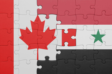 puzzle with the colourful national flag of syria and flag of canada.