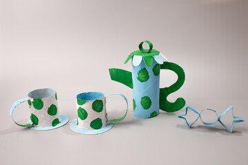 Handmade tea or coffee set crafted from a toilet roll by a child, Toy creation.