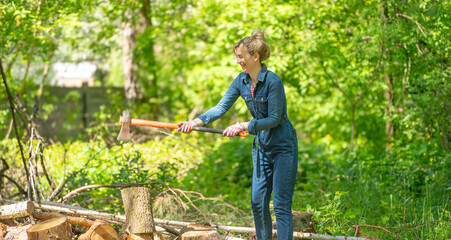 woman chopping wood with an ax