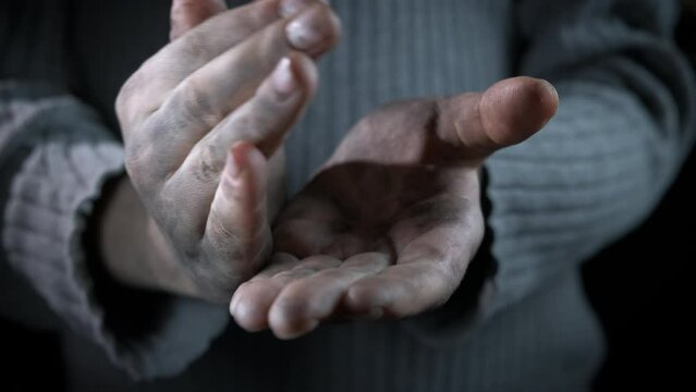 Poor dirty female with empty hands. A poor female with empty hands suffer from crisis.