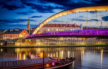 Krakow - panoramic view of the Vistula River floating under the bridge in Podgórze district