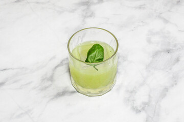 Cocktail Gin Basil Smash decorated on the bright table.