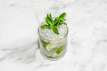 Cocktail Caipirinha decorated on the bright table.