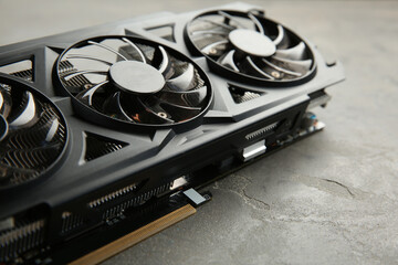 One graphics card on grey table, closeup