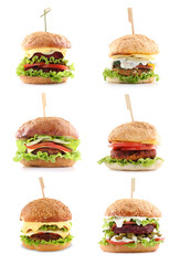 Different delicious vegetarian burgers isolated on white, set