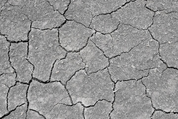 Wall texture soil dry crack pattern of drought lack of water of nature brown old broken background.