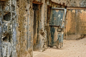 Broken door hanging, part of the ruins of the fortification on the island of Corregidor left over from World War II, Philippines_04042007_0097