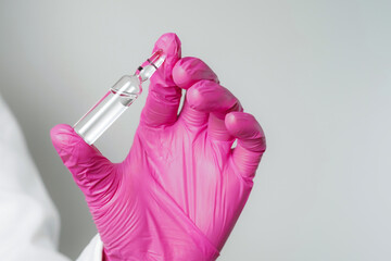 doctor or scientist holding ampules medicine vaccine and bottle for injection