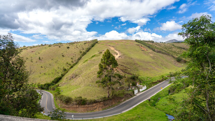 Fototapeta premium Sharp curve on a road in a Colombian countryside.