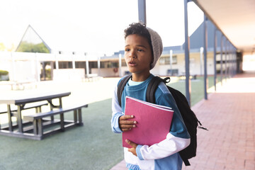 Biracial boy ready for school, with copy space