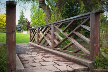 Wooden bridge with crisscross railing in a park