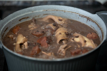 Traditional and irresistible Brazilian feijoada closeup