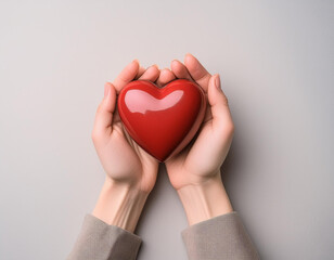 Obraz premium hand holding red decorative heart