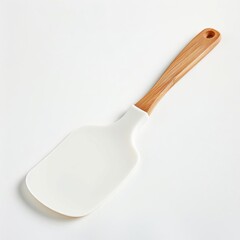 White plastic spatula with a wooden handle on a light background, ideal for kitchen and cooking purposes.