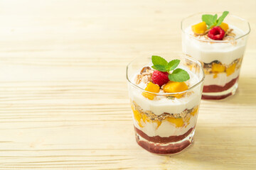 homemade mango and raspberry with yogurt and granola
