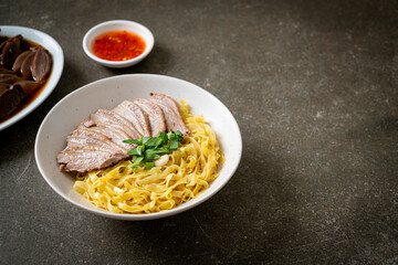 dried duck noodles in white bowl
