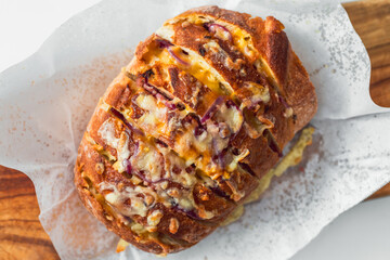 homemade stuffed bread loaf with cheese and caramelised onion