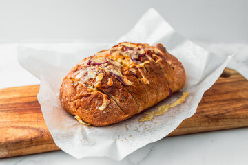 homemade stuffed bread loaf with cheese and caramelised onion