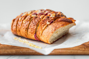 homemade stuffed bread loaf with cheese and caramelised onion