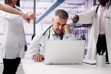 Blaming And Bullying Doctor. Pointing Finger