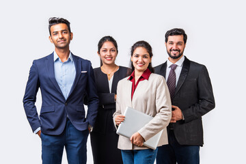 Indian asian young business professionals executive standing in group and looking at camera