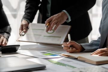 a group of businesspeople is discussing about new project that is coming up soon, those employees is shearing their idea to each other to choose the best strategy