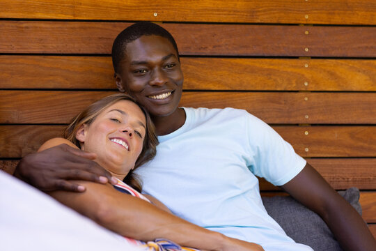 A diverse young couple relaxing at home, enjoying each other's company