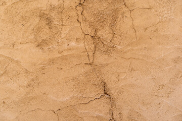 old brown cement top view table or ancient yellow paint surface to cracked concrete golden wall for rupture texture rough floor background or retro backdrop construction to antique vintage wallpaper