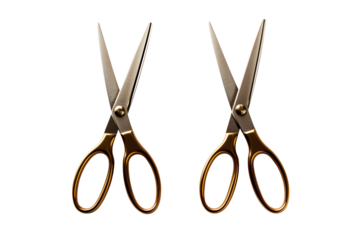 A pair of open golden scissors on a transparent background