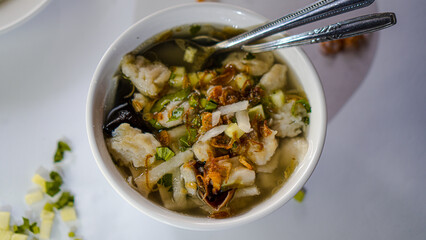 A close-up shot from a top-down perspective of a bowl of tekwan