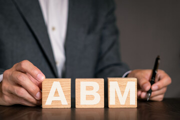 There is notebook with the word ABM. It is an abbreviation for Account Based Marketing as...