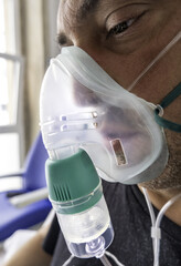 Sick man with oxygen mask