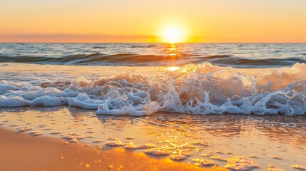 Obraz premium The sun sets over the ocean, waves crash on the shore, water splashes on the beach, sand meets the shoreside