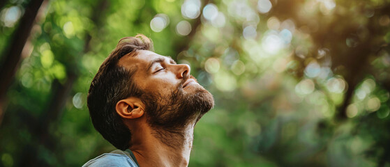 Bearded man taking a moment of peace in nature