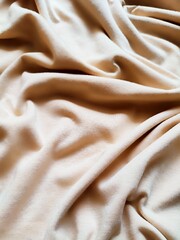 texture and background of wrinkled cream fabric