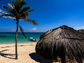 Caribbean beach of fine white sand and crystal clear turquoise water, where in summer tourists and travelers come to enjoy summer vacations and relaxation.