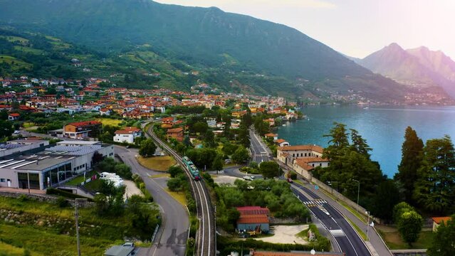 Aerial view of Italian town of Limone Sul Garda on Lake Garda, Italy. Limone Town in Italy on the Lake Garda, beautiful mountain views, old town red roofs, green lake.