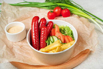 sausage with french fries and vegetables
