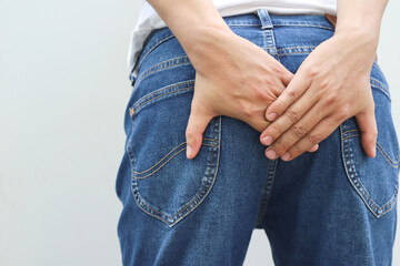 portrait of a woman suffers from diarrhea his stomach painful. ache and problem. hand hold tissue...