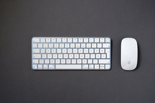 Antalya, Turkey - April 23, 2024: Apple magic keyboard and magic mouse on dark gray background