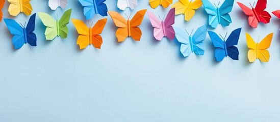 Step-by-step guide creating a yellow paper butterfly in origami style, showcased in a photo collage on a light blue background with copy space image.