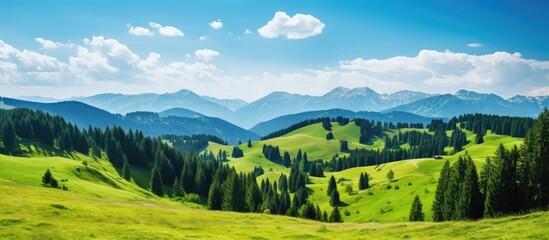 Obraz premium Scenic mountain landscape with dark blue skies and fluffy clouds, ideal for adding text or images with a lack of elements in the foreground - copy space image.